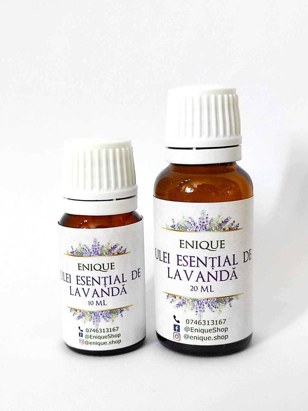 Two bottles of Enique Lavender essential oil on a white background